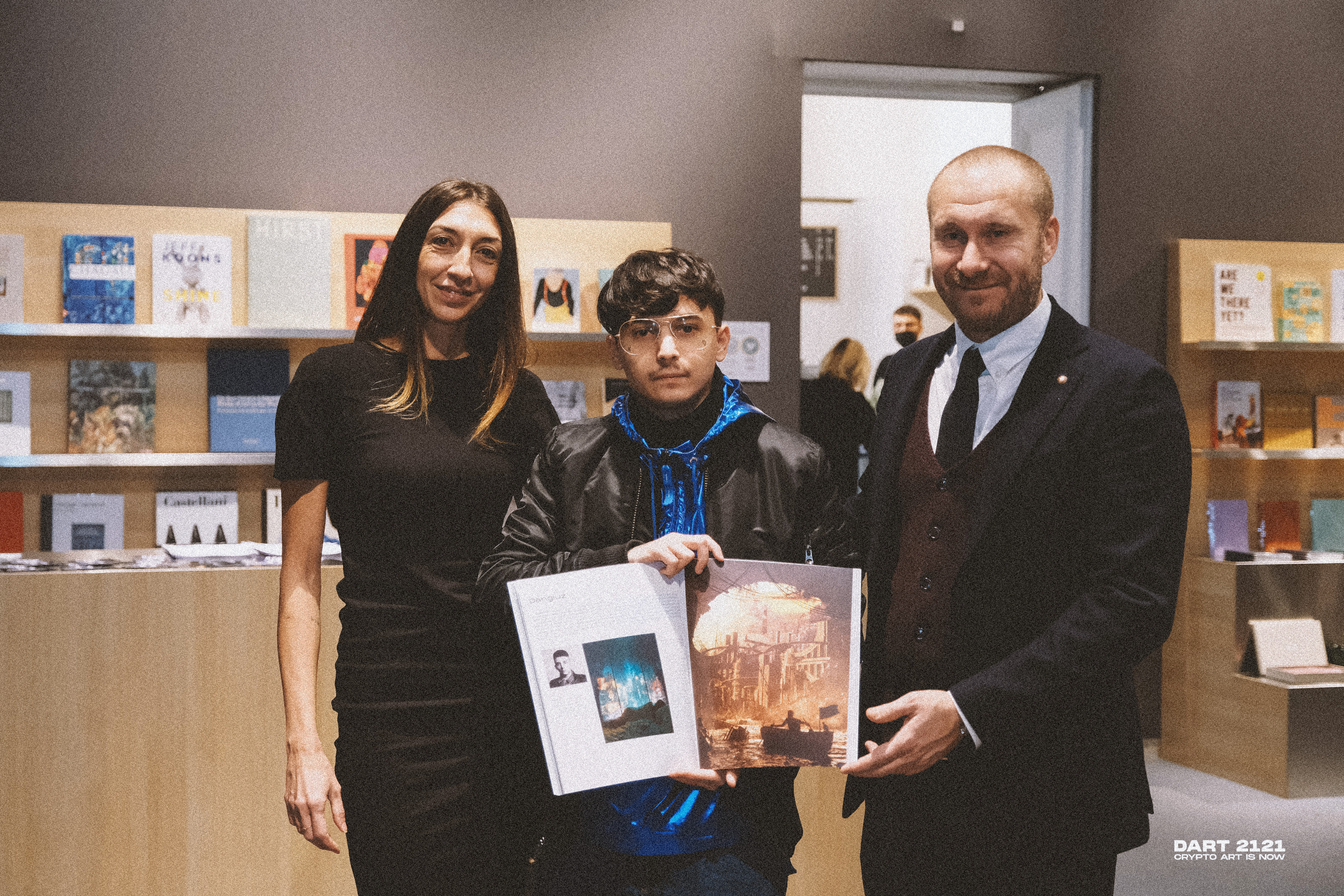 Dangiuz with the curators, featured in the Museo della Permanente catalogue